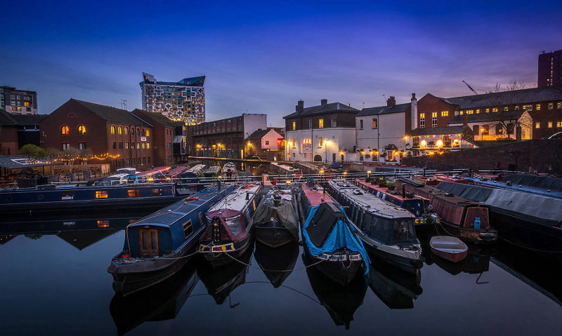 long boats moored gas st basin birmingham at dusk. photograph taken for brochure by mike kelly photographer picturepress.
