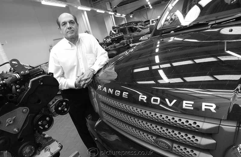 man with Land Rover in work shop.  image produced for news letter. by picturepress  photography