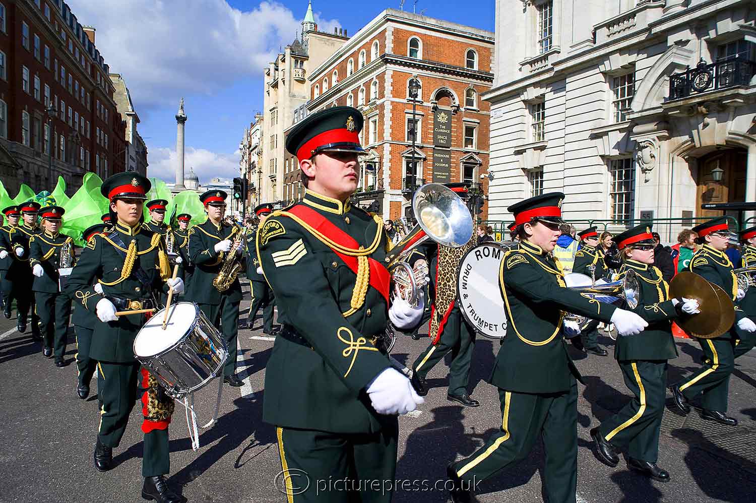 St Patricks Day parade in london marching band of musicians in uniform. photograph taken for brochure by mike kelly photographer picturepress. 
